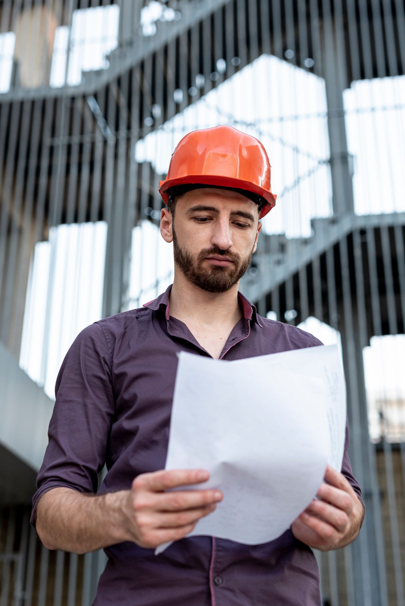 construction worker looking at a paper