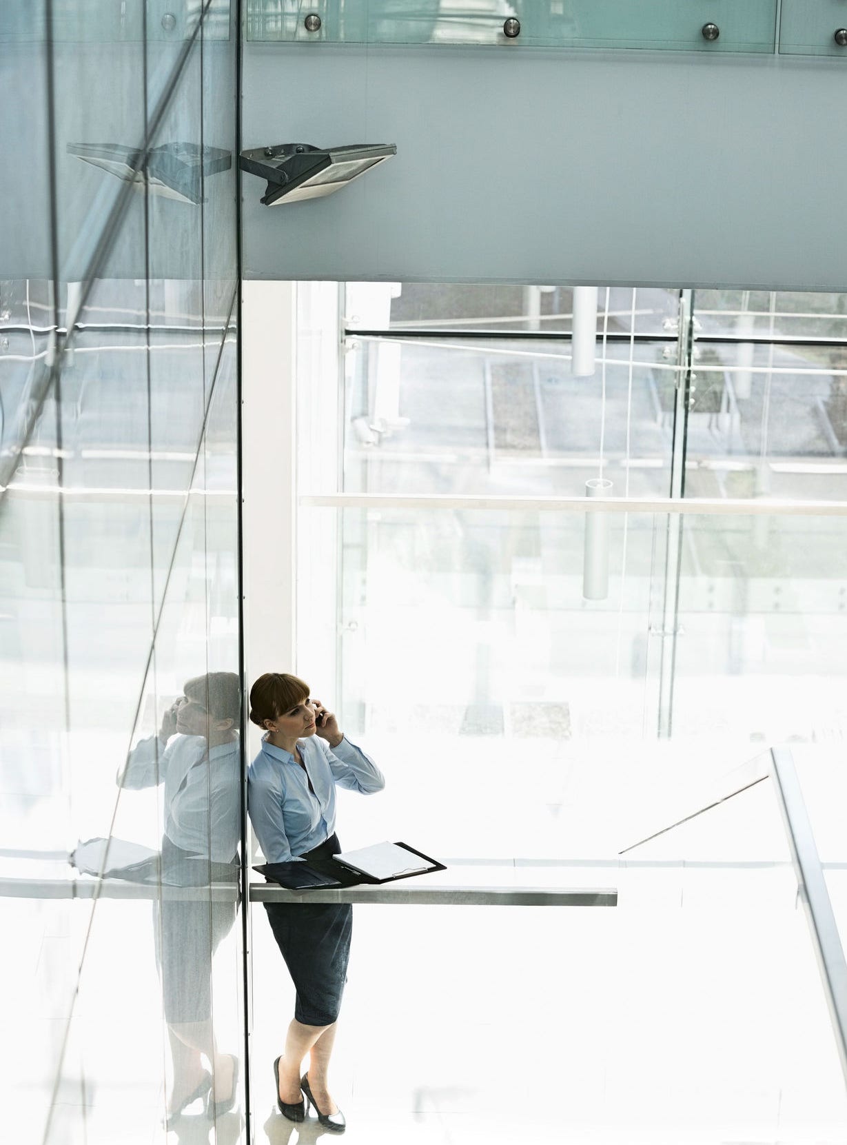 Woman standing beneath stairs