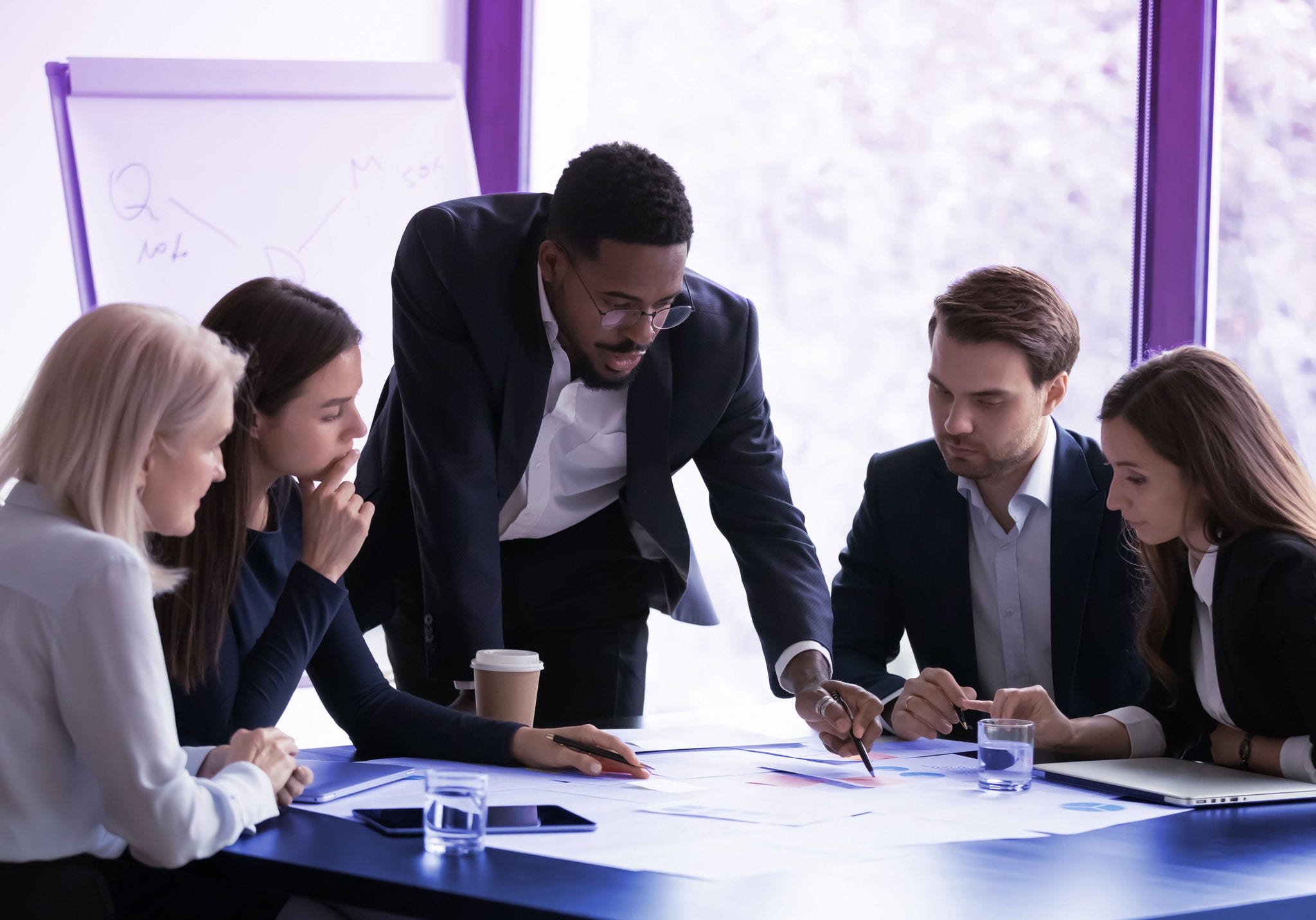Confident biracial businessman head meeting with diverse colleagues