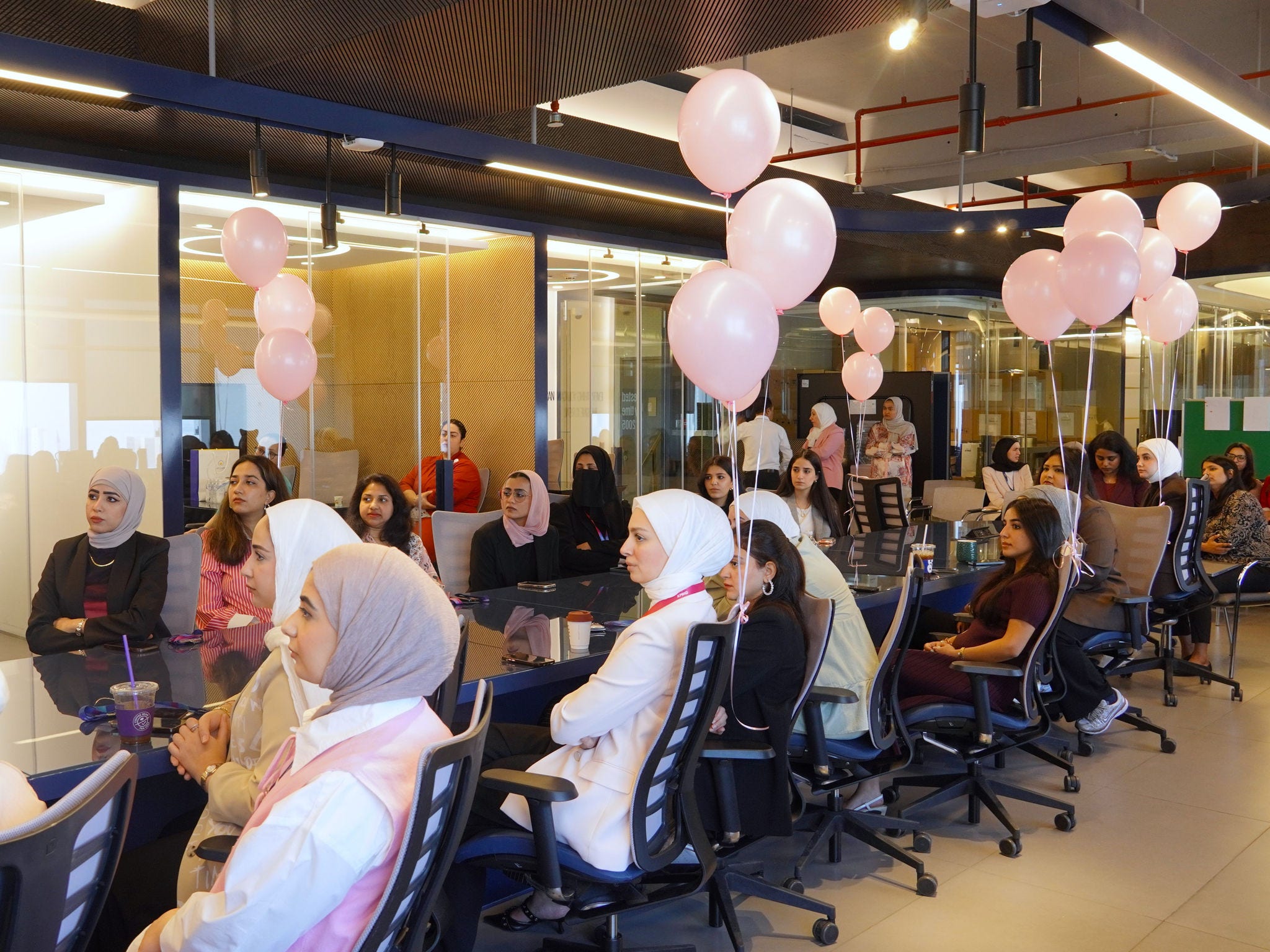 Picture of female employees of KPMG Kuwait in a Breast Cancer Awareness event 