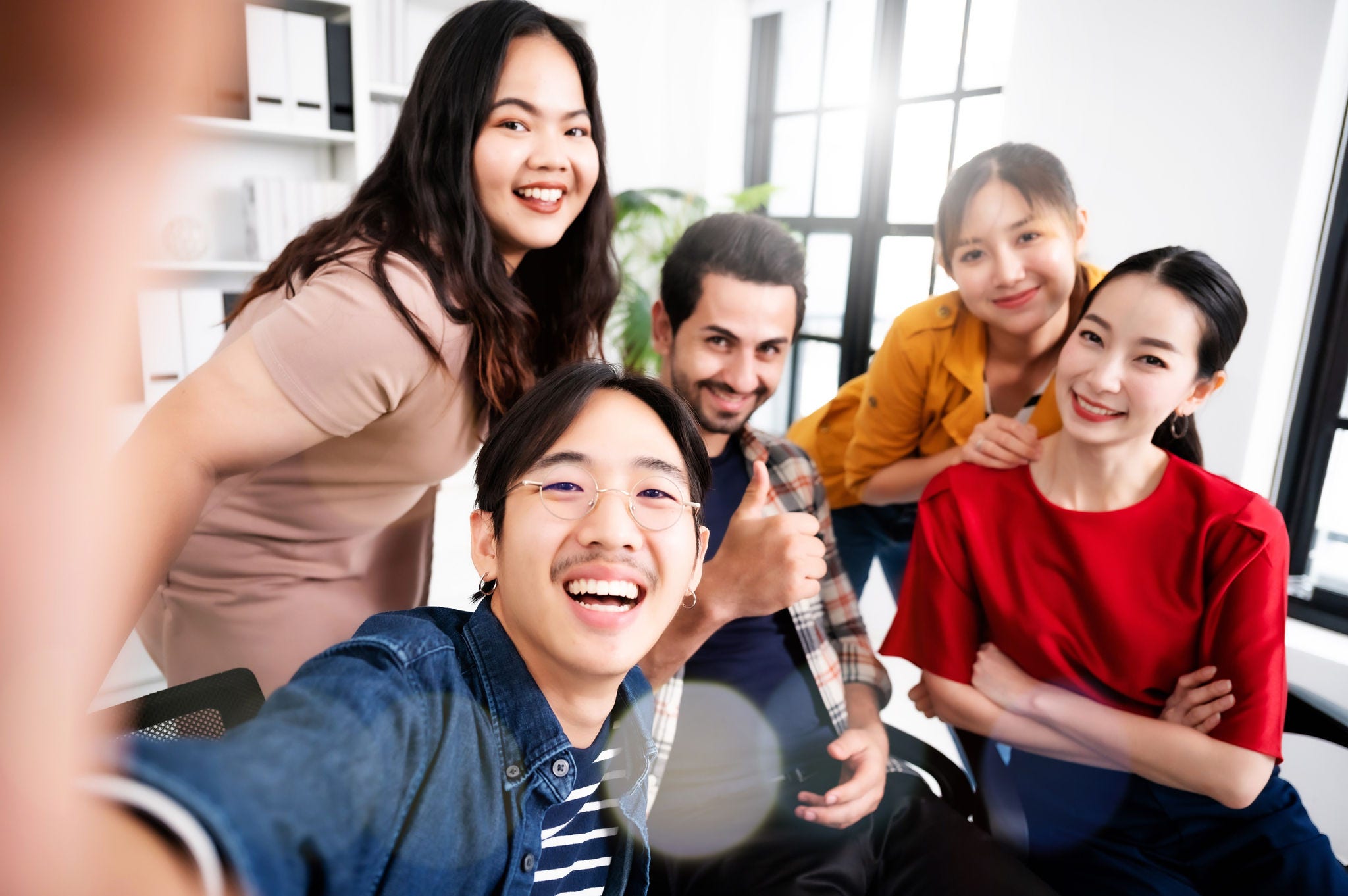 Selfie of group young man and woman team smiling having fun together