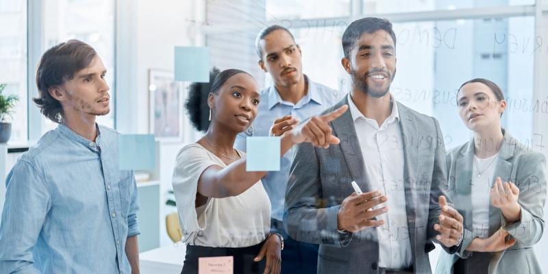 people pointing at notes