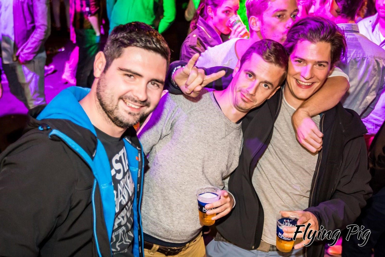 Three people posing at a party