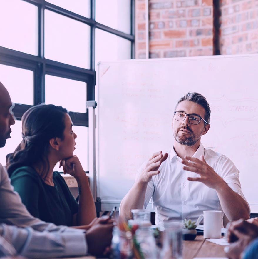 Man explaining in meeting Man explaining in meeting