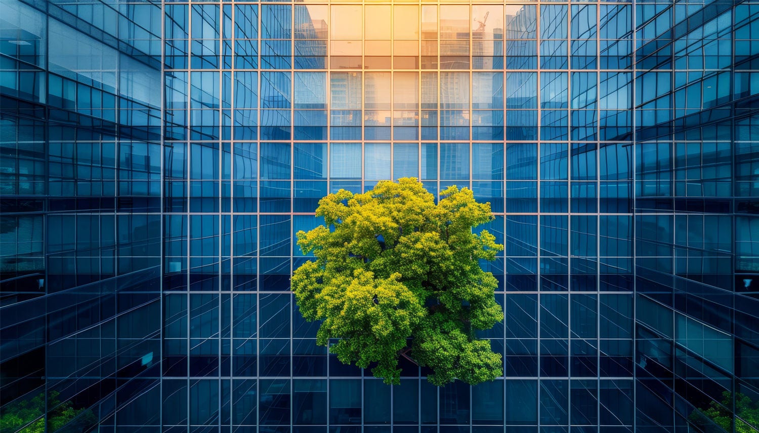 Eco-friendly building in the modern city. Sustainable glass office building with tree for reducing carbon dioxide. Office building with green environment