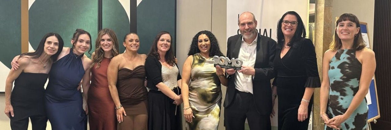 Colleagues at an award ceremony after winning award