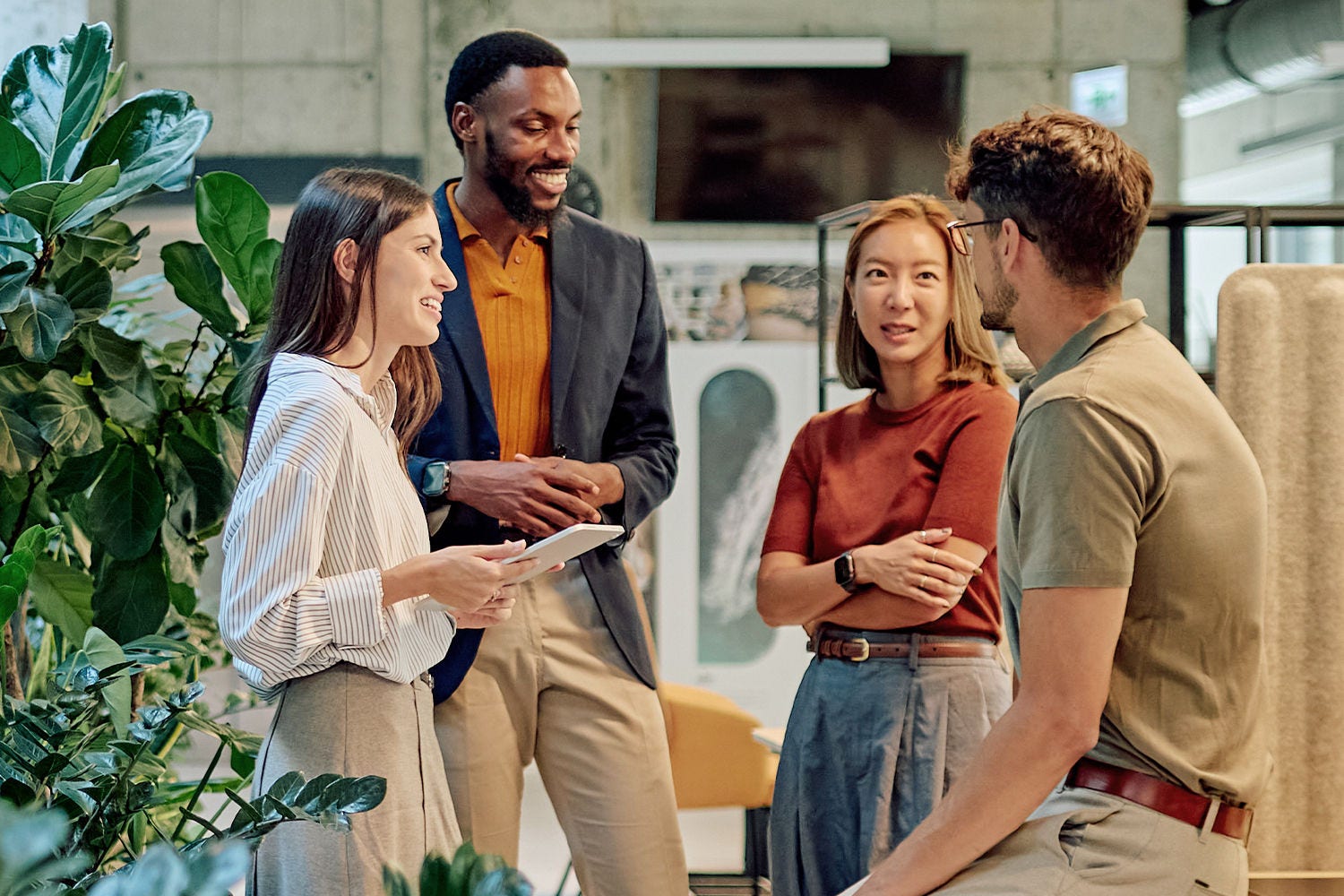 Colleagues discussing in office
