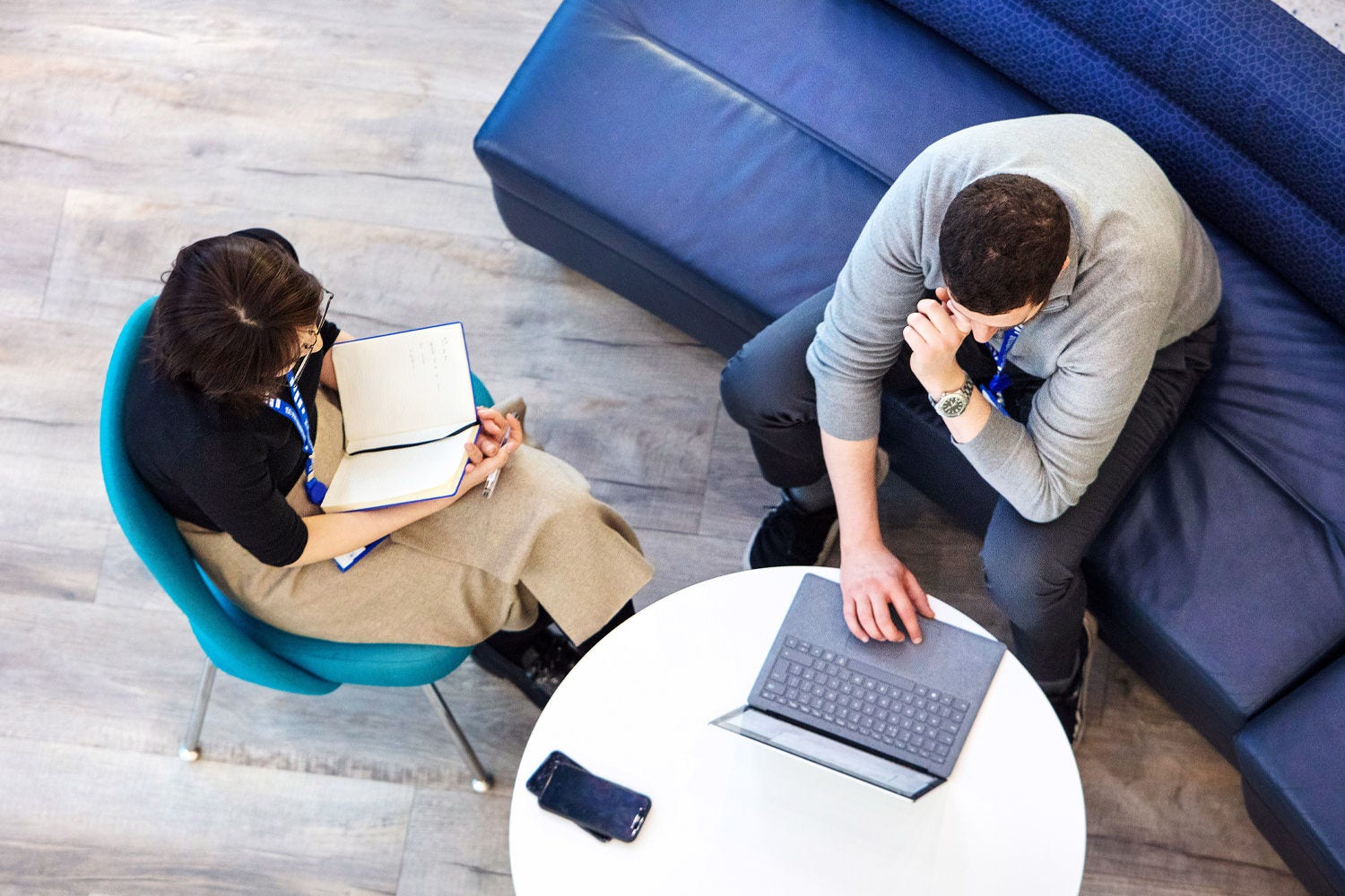 people pointing at notes