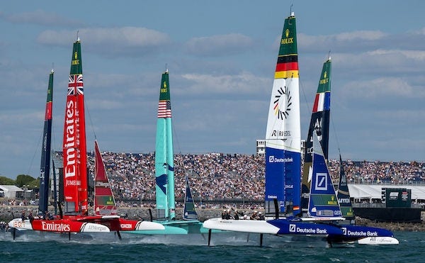 SailGP racing catamarans competing on the water.