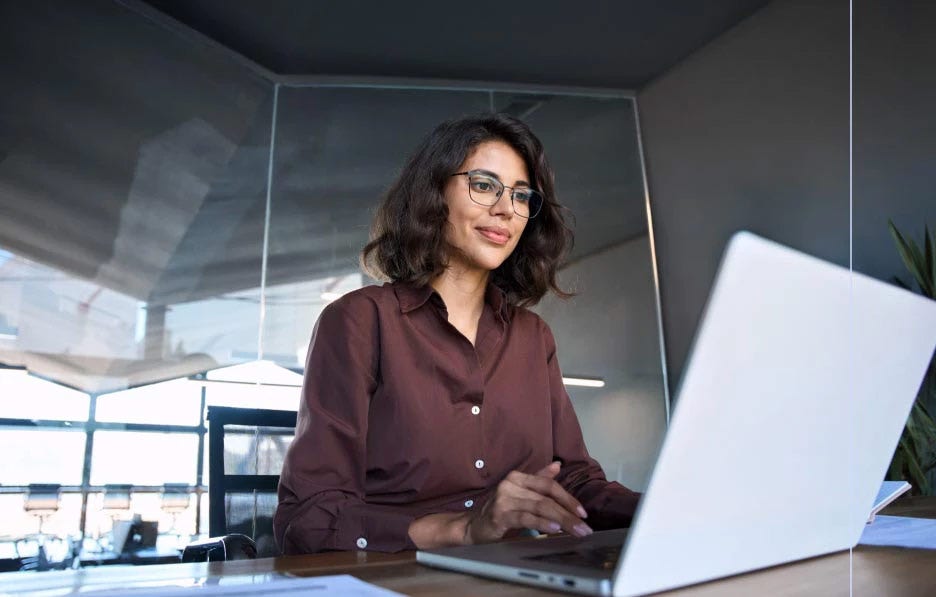 Woman using laptop in office