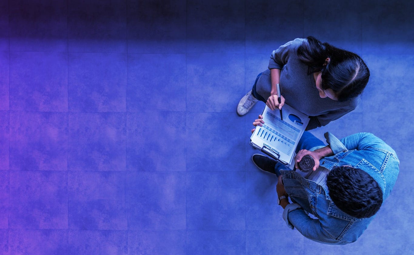 Banner of top view of young asian business team standing, talking and reporting with annual report document in modern workplace. Above view of casual creative team discussion with report performance.