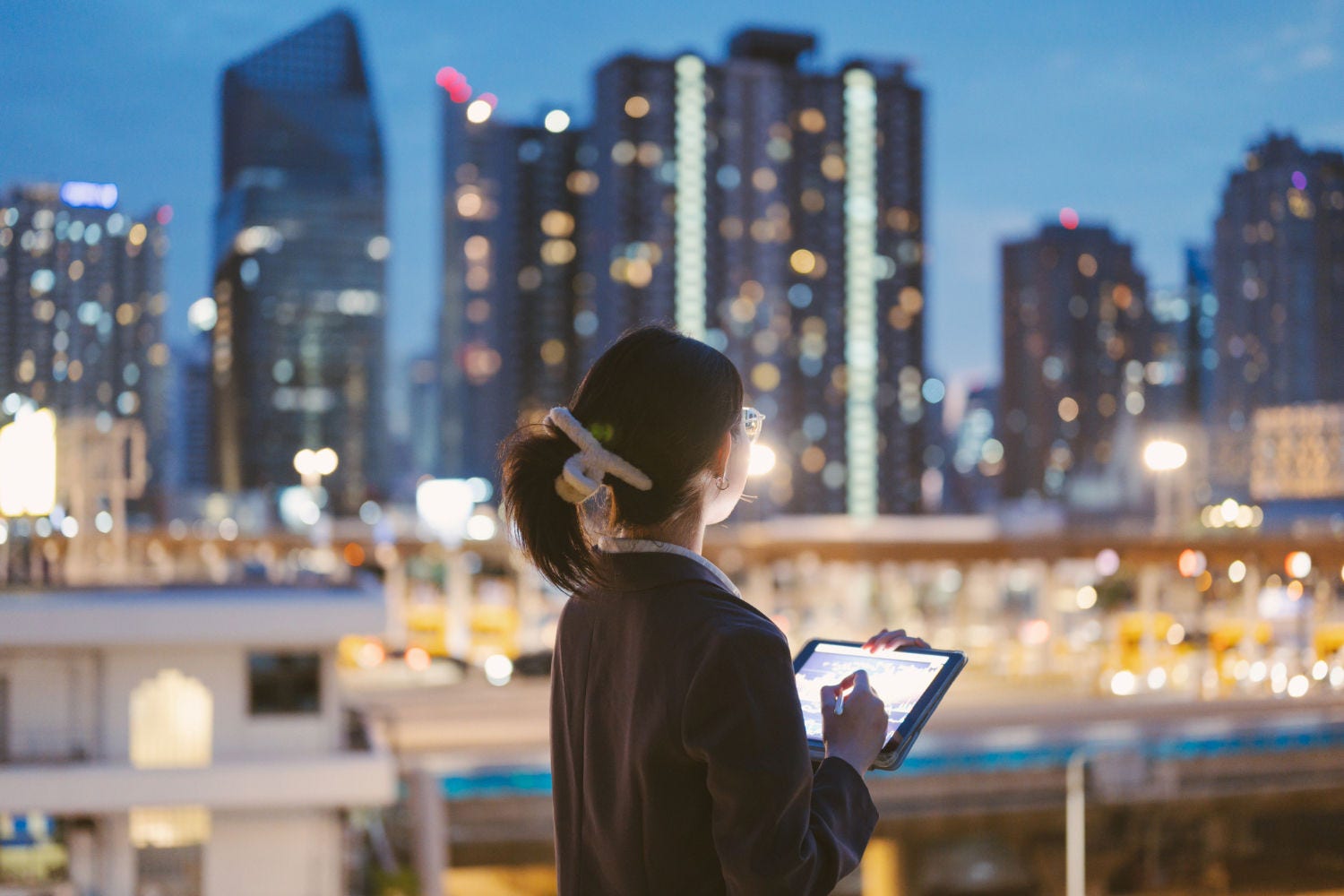 woman holding tablet