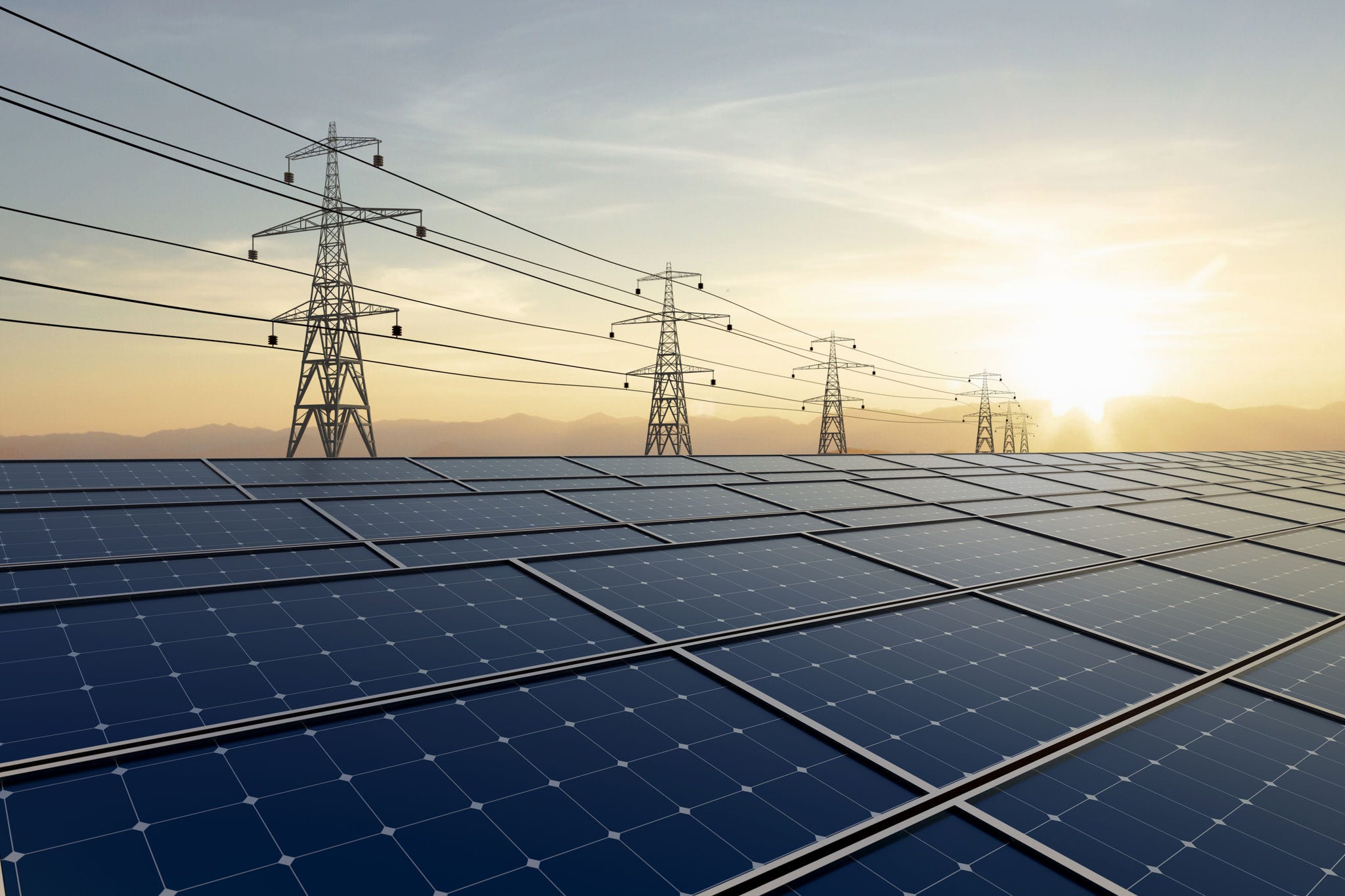 Solar farm with power lines at sunset in a natural landscape. Clean energy and sustainable resource concept.