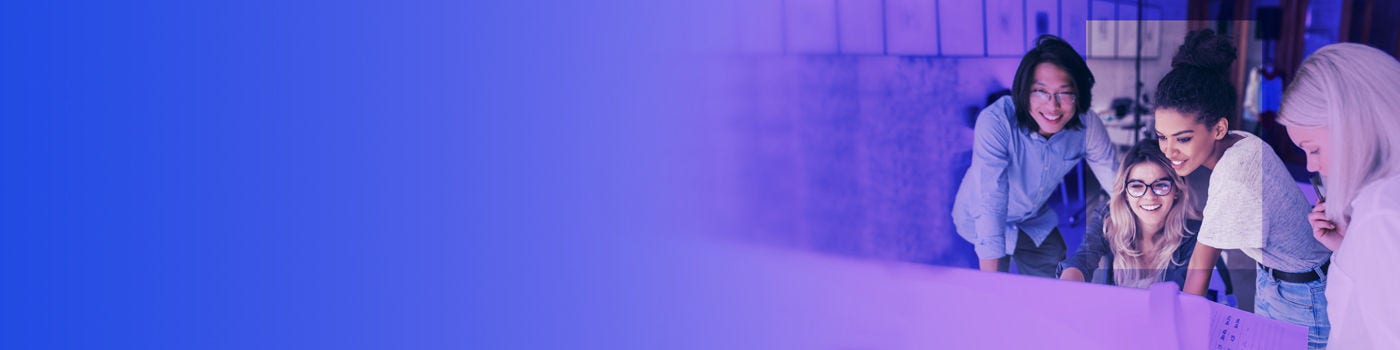 Woman watching something on computer and smiling