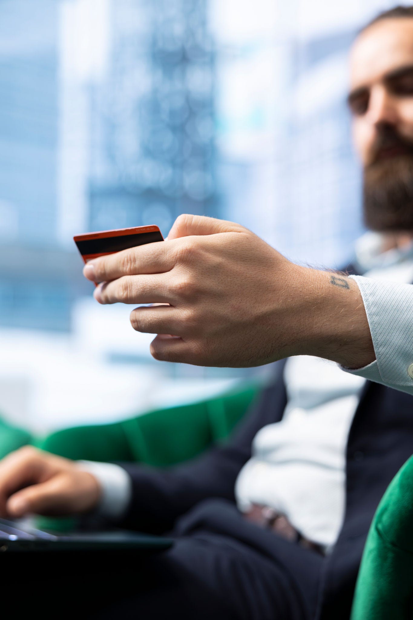 credit card in front of laptop