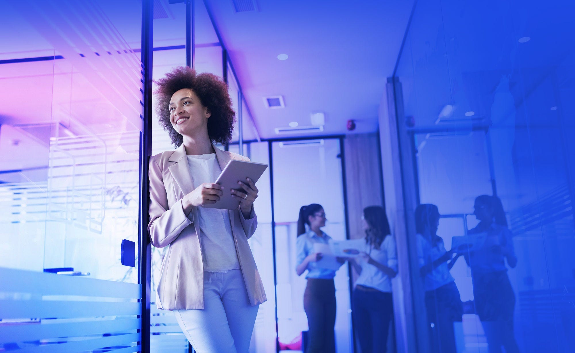Portrait of a happy young black business woman smiling