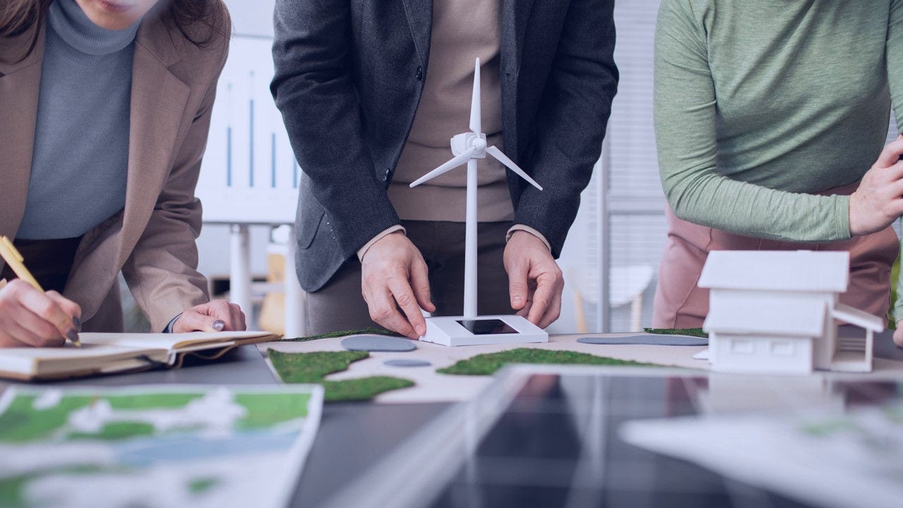 Persons working together on environemental solutions.