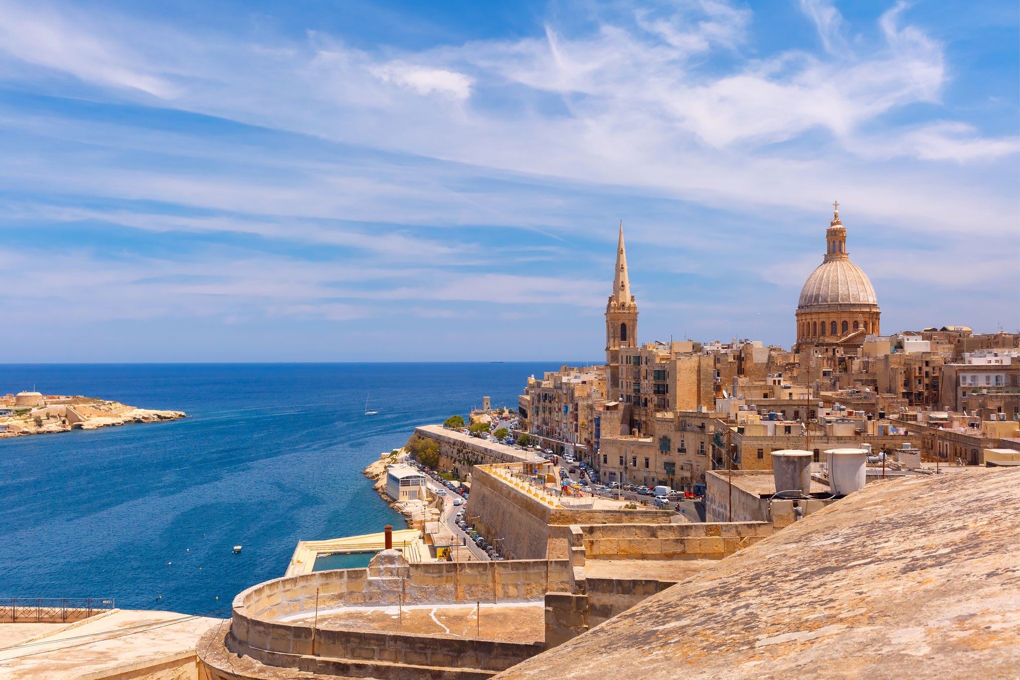 View from above of the domes of churches and roofs with church of Our Lady of Mount Carmel and St. Paul's Anglican Pro-Cathedral, Valletta, Capital city of Malta