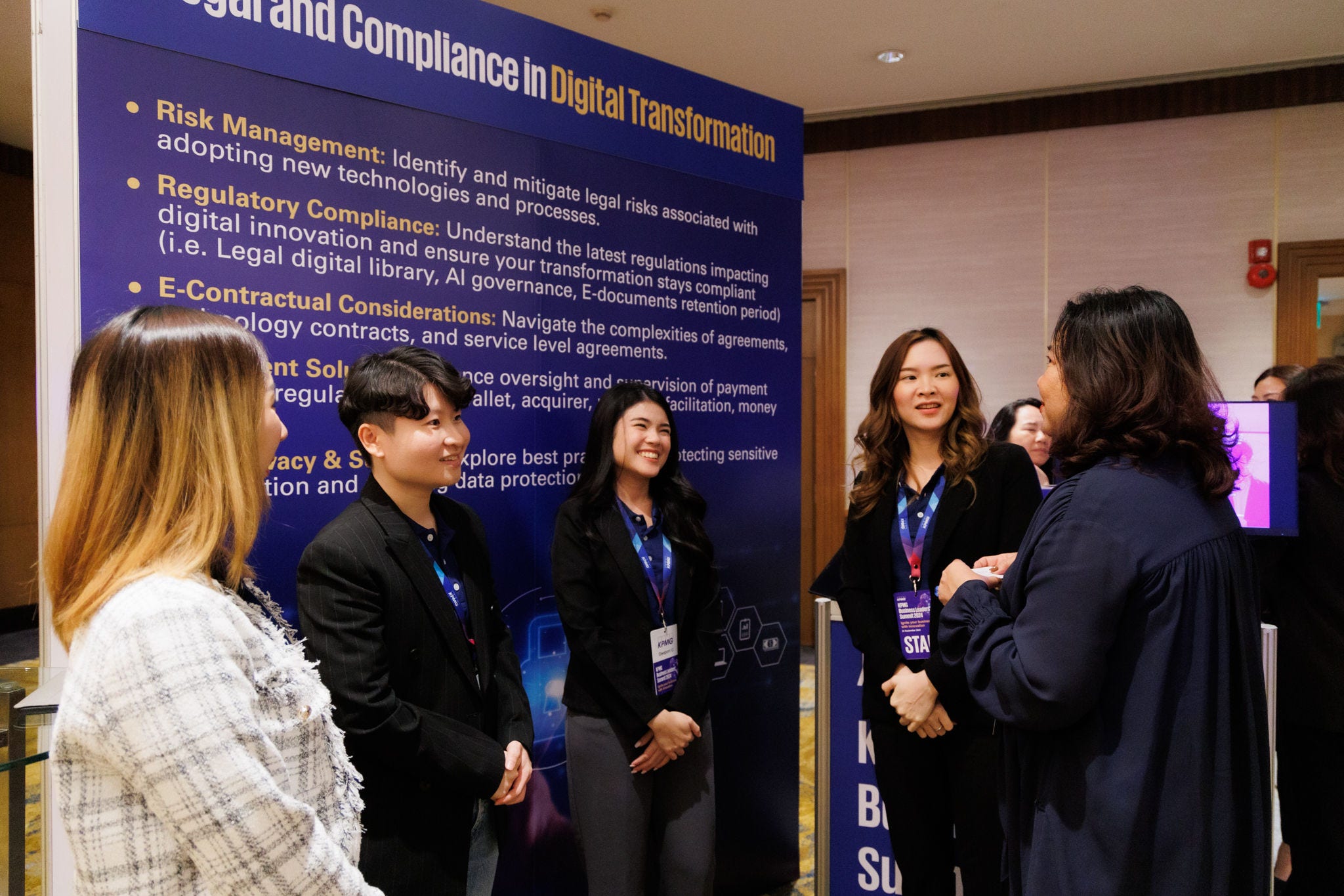 Attendee visiting KPMG Digital Transformation booth and talking to KPMG specialists