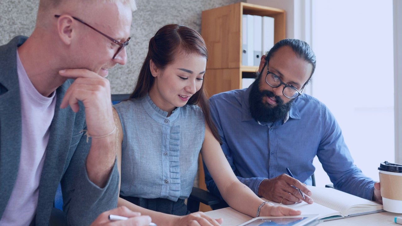 Persons working together.