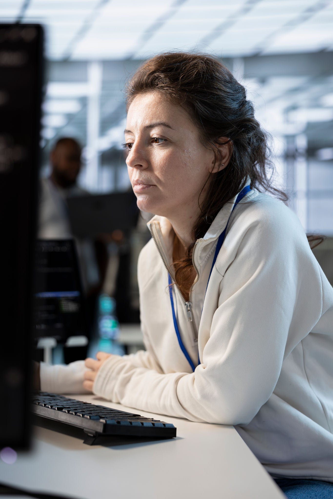 System administrator in server hub implementing power management solutions to reduce energy consumption. Employee integrating new technologies and systems in data center facility