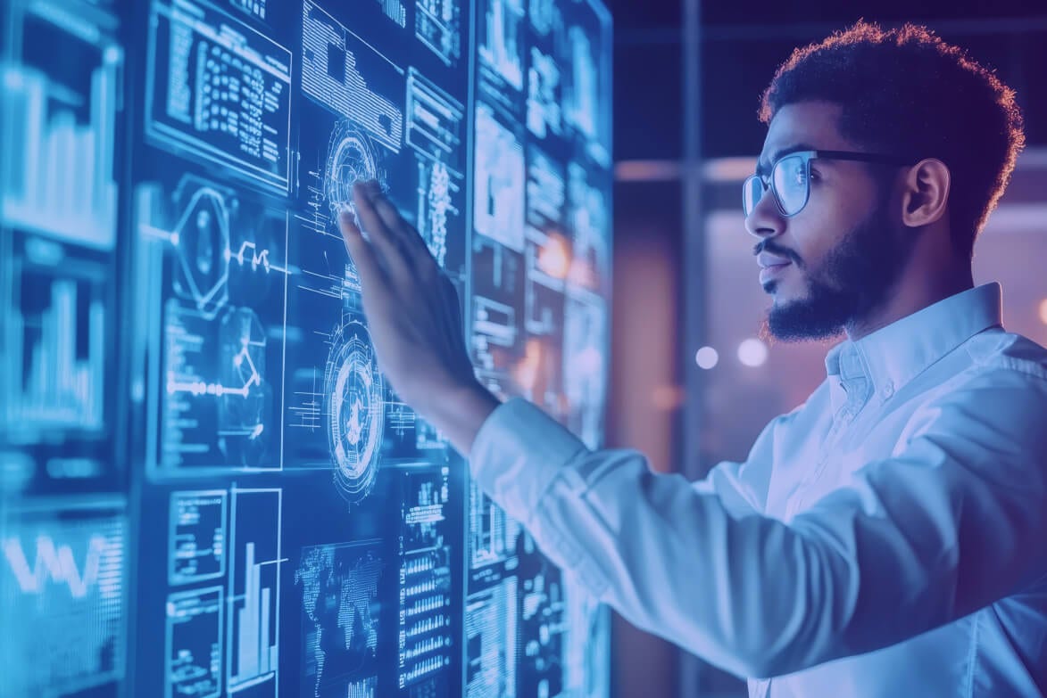 Man viewing data on an interactive whiteboard