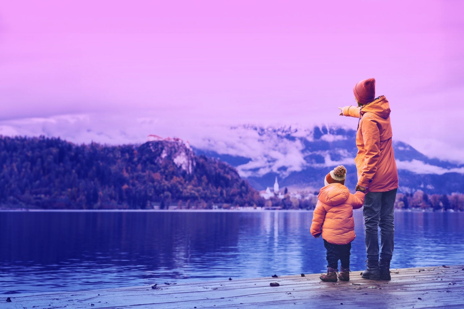 Father and Son Standing Near A Lake