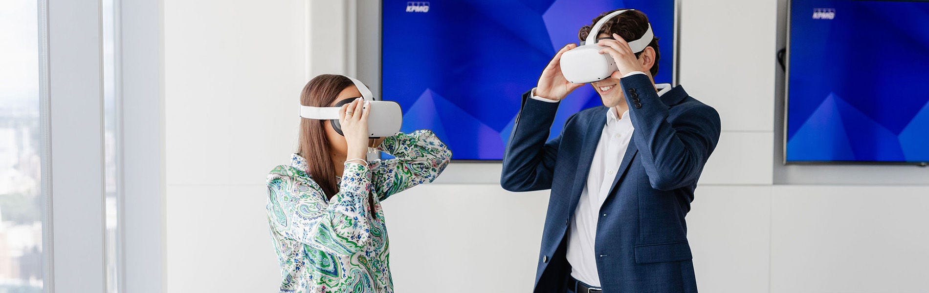Business people looking at virtual reality headset gear