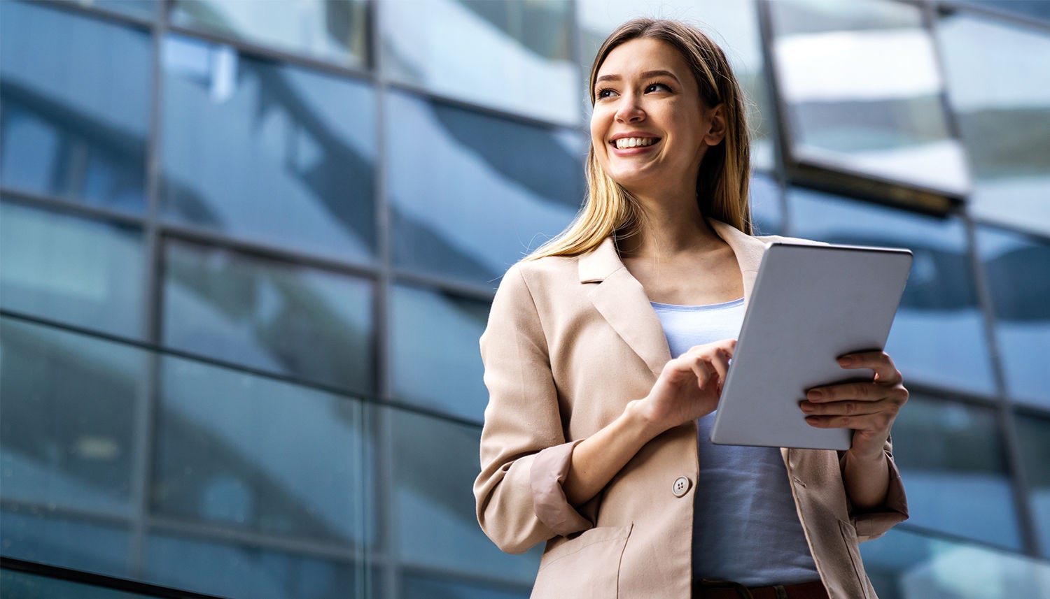Portrait of successful woman using digital tablet in urban background. Business people concept Portrait of successful woman using digital tablet in urban background. Business people concept