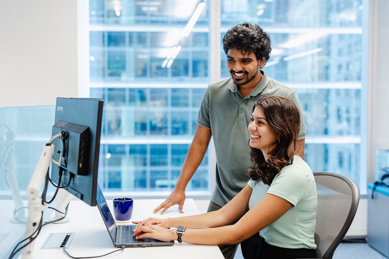 Two KPMG employees at computer