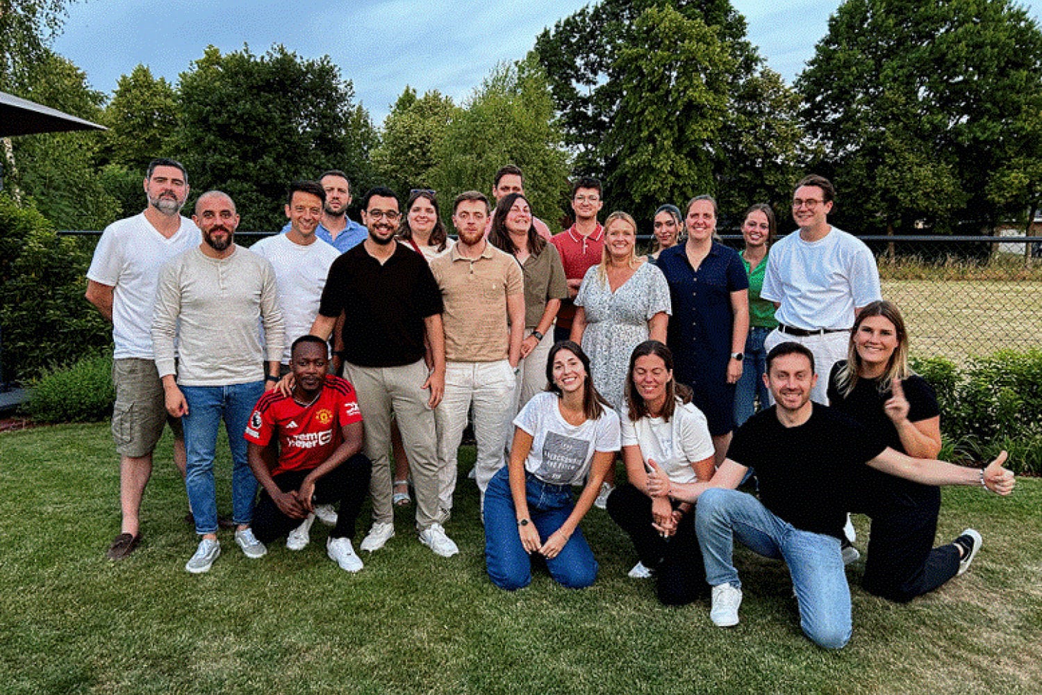 A group of people posing in nature