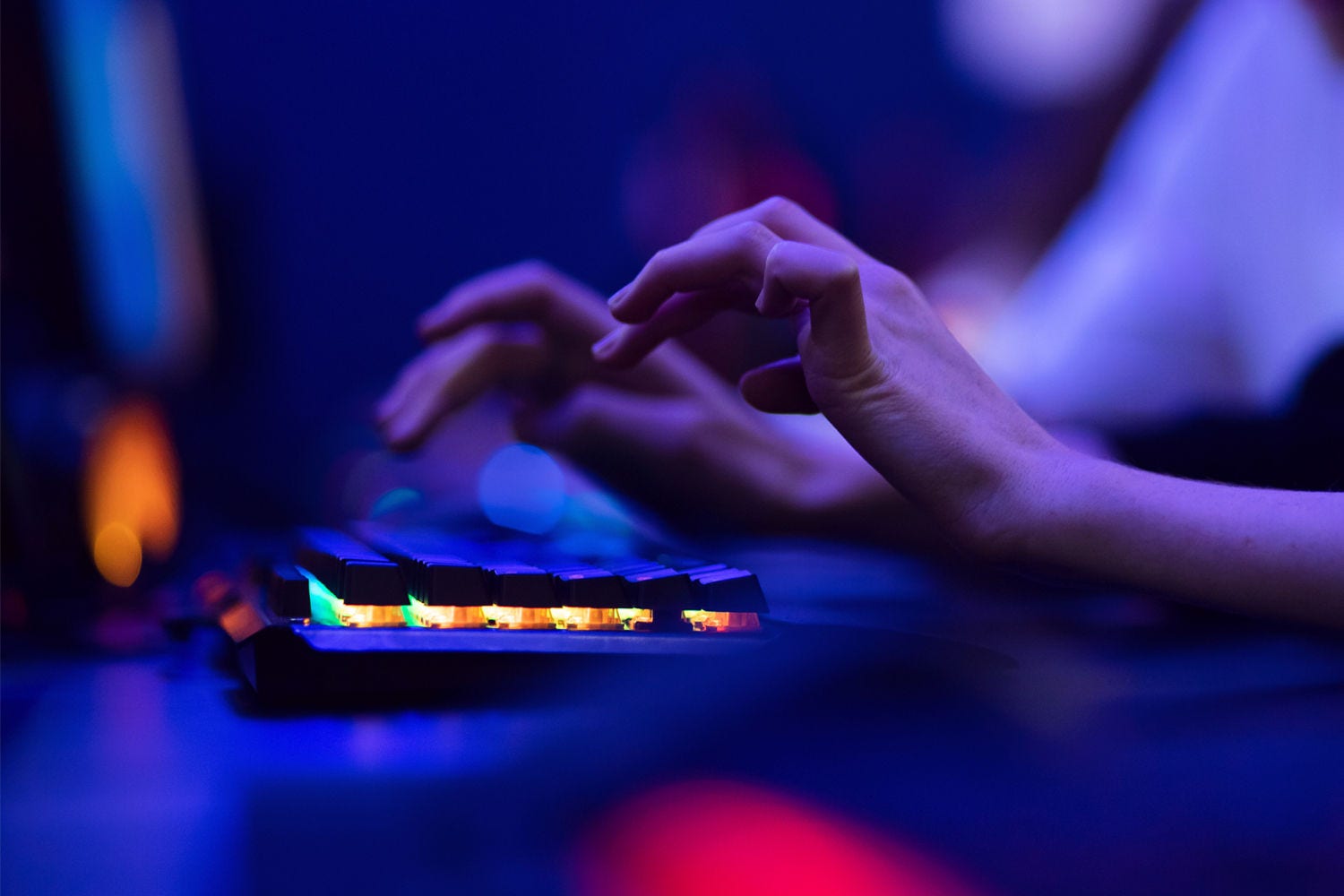 Woman woeking on computer in dark