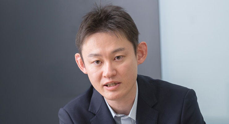 Japanese alt text: KDDI　奥氏