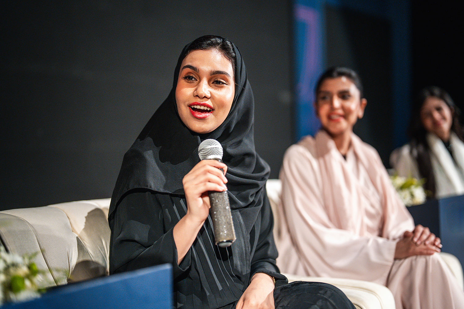 coworkers writing on a white board and talking