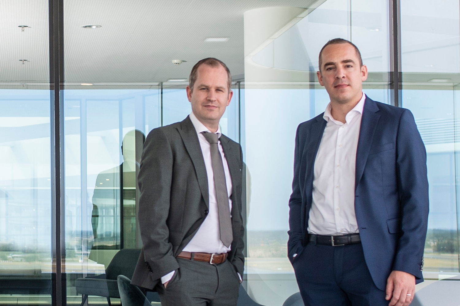 Two KPMG experts, Jeroen Trumpener and Paul Dreezen, are looking at the camera