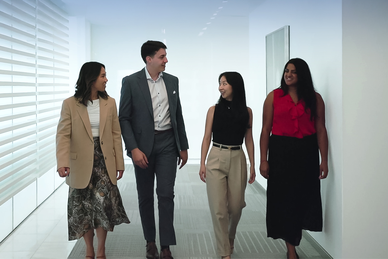 colleagues walking down hallway