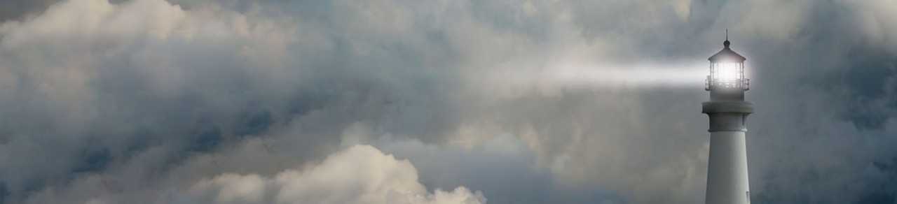 lighthouse in a dark sky