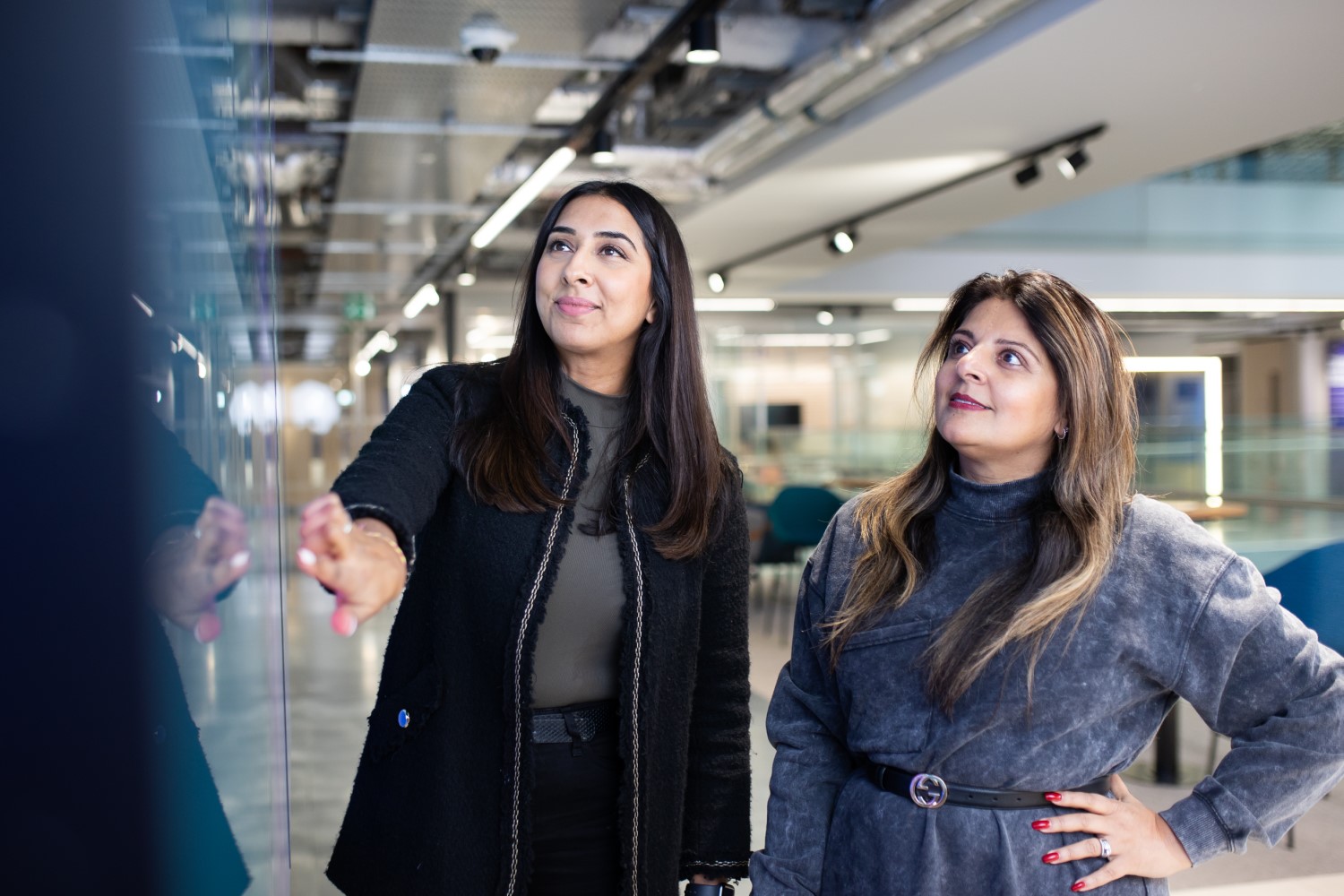 two women looking at data