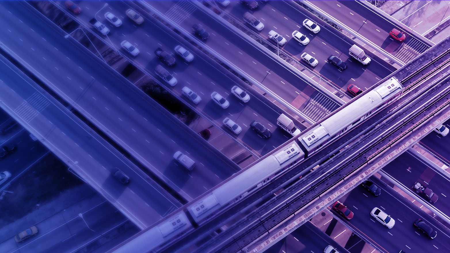 aerial view of a train bridge over freeways