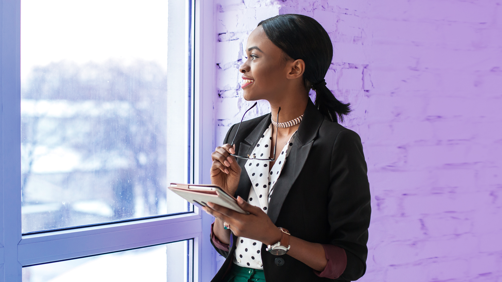 woman regarding window