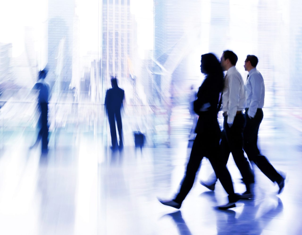 Three People walking through office in formals
